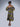 Brown girl wearing a purple and yellow cut out midi dress