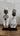 Two decorative Namji Doll figurines with intricate designs on a wooden surface.